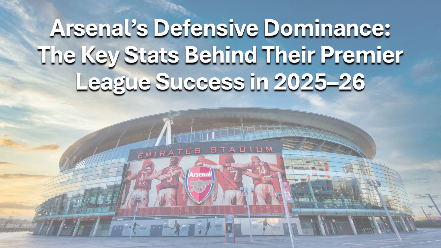 Exterior view of Arsenal’s Emirates Stadium with article title text overlay, representing Arsenal’s defensive strength and dominance in the 2025–26 Premier League season.